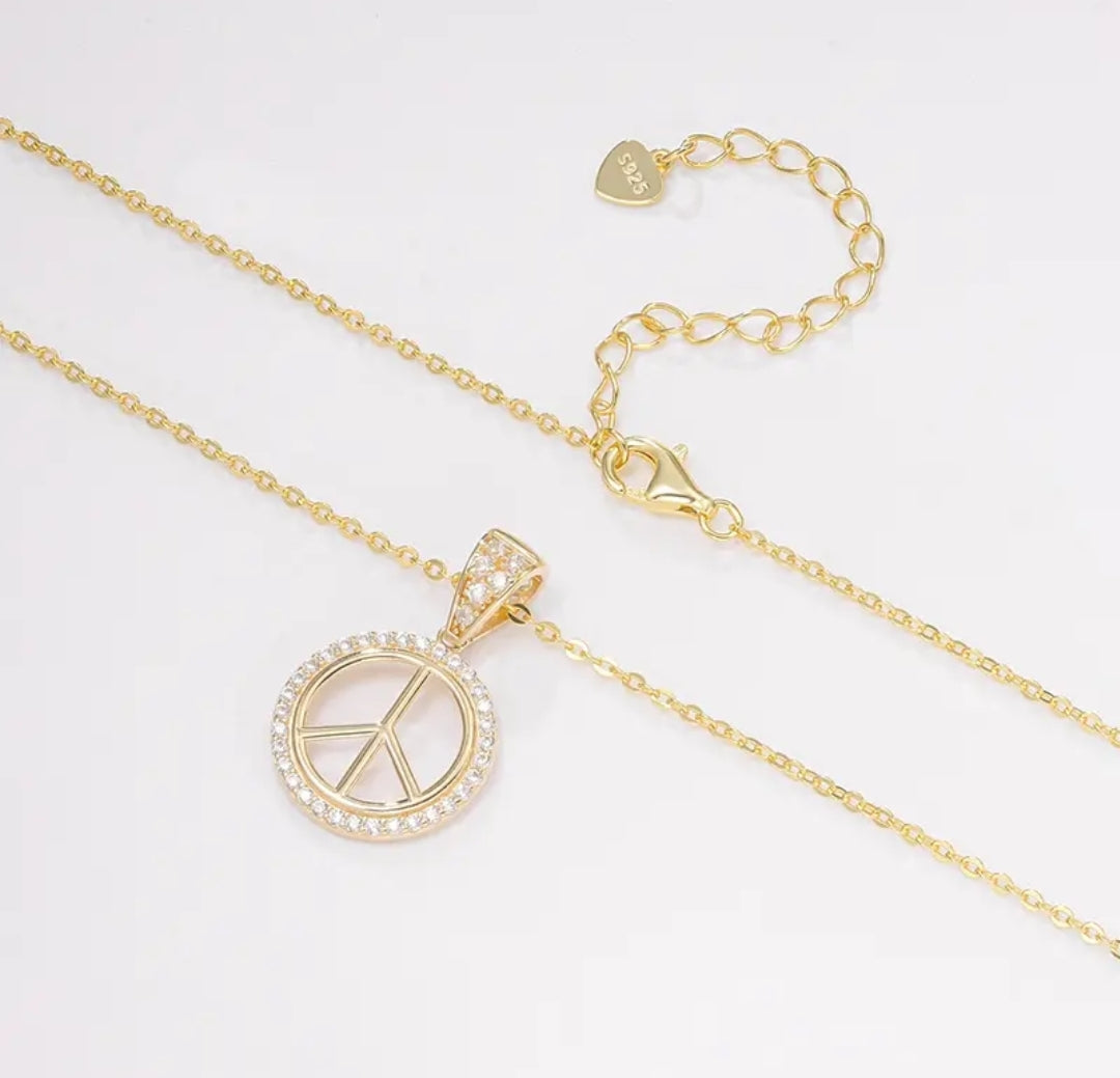14k solid gold peace symbol necklace with 1.3mm zircons