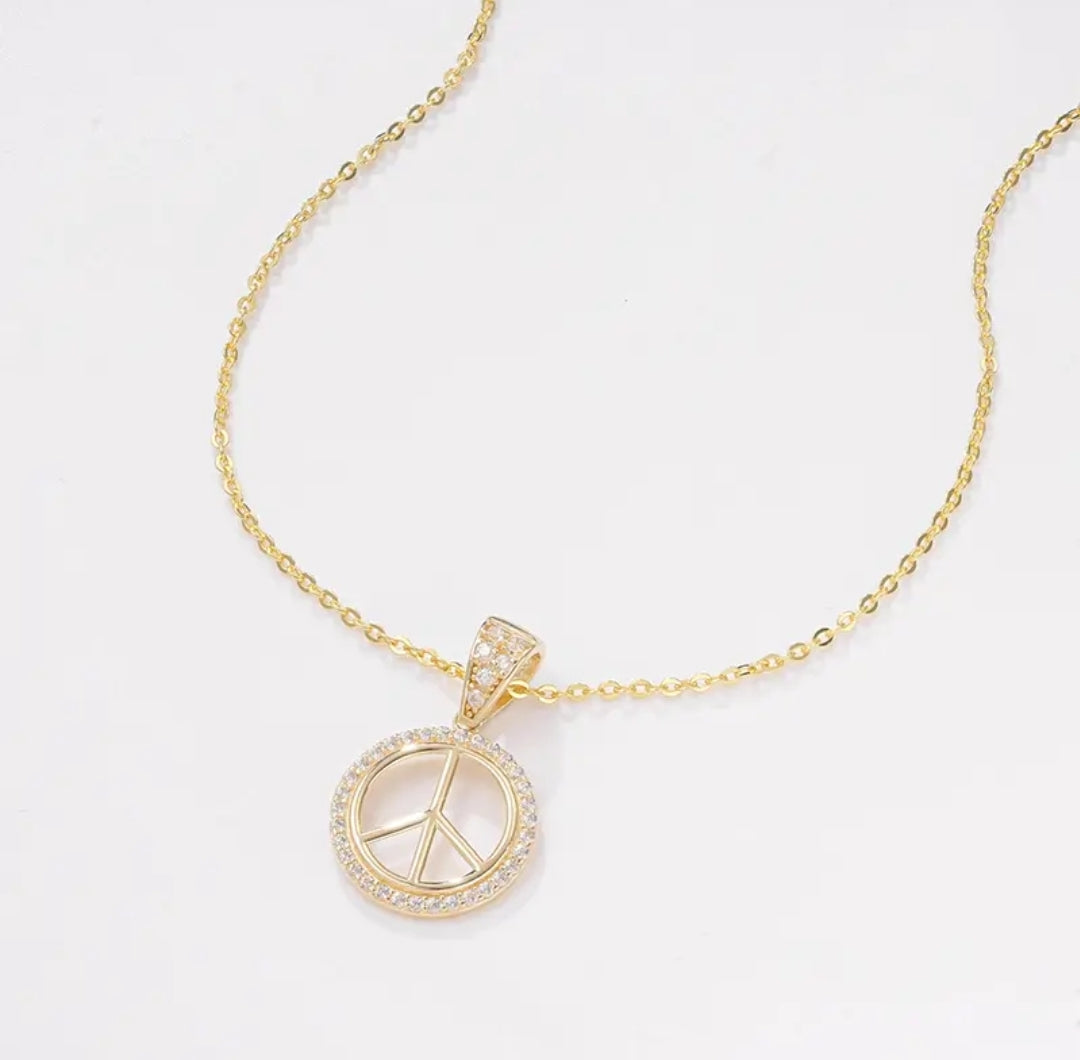 14k solid gold peace symbol necklace with 1.3mm zircons